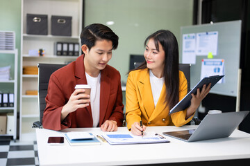 Portrait of success business people working together in office. Couple teamwork startup concept