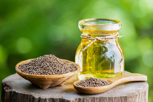 Perilla seeds and oil on natural background.