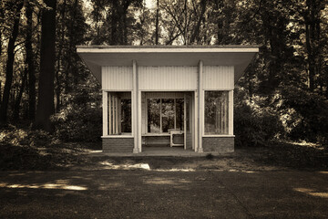 Monochrome shot of a shelter in a cemetery.