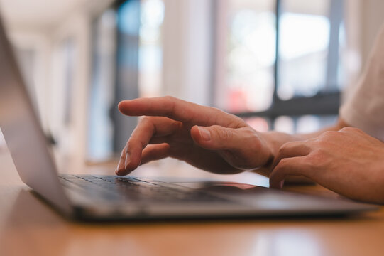 Man using laptop for research, Customer service help desk advice online support Contact us or Customer support hotline, DevOps software development and IT operations programer development concept