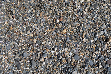 Texture of small stones found on a beach.