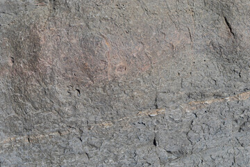 Stone texture worn by the wind and the sea of ​​the coast located on a wild beach.
