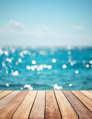Wood table top on blur sparkling sea water and summer sky background © Giuseppe Cammino