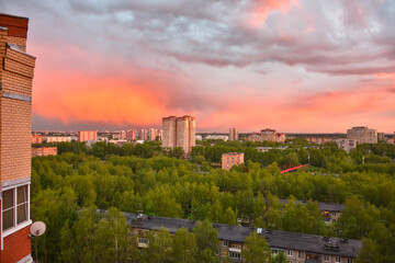 Colorful sunset over city, bright colorful sky over city