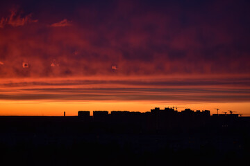 Colorful sunset over city, bright colorful sky over city