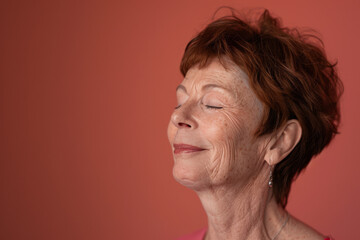 Fototapeta premium A close up of a woman's face with her eyes closed looking to a side