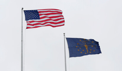American and Indiana State Flag flying in the Air in Indianapolis, IN, USA