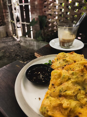 crispy fried tempeh Indonesian dish with coffee side