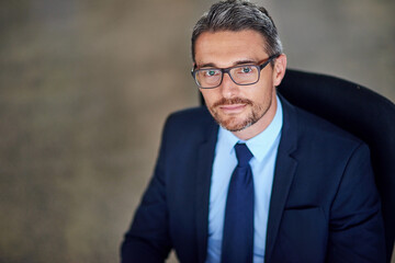 Office, portrait and businessman in chair, glasses and opportunity at law firm on high angle. Lawyer, attorney or mature man with professional pride, about us or consultant at legal advisor at agency