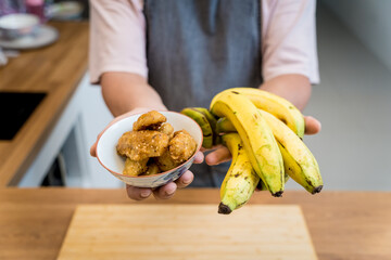 Crispy fried bananas in the small white bowl