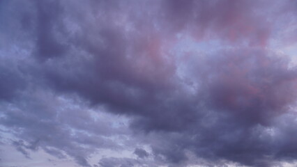 Clouds before a thunderstorm at sunset as an abstract background