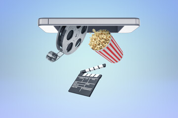 Film reel and popcorn floating under phone