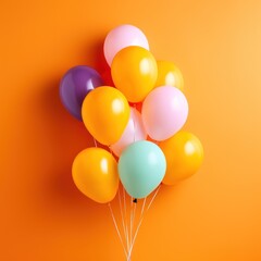 Colorful balloons bunch tied on wall background 