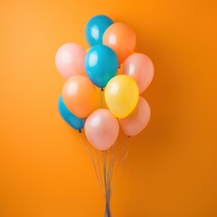 Colorful balloons bunch tied on wall background 