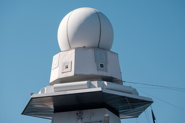 Closeup of a radar installation on a modern warship.