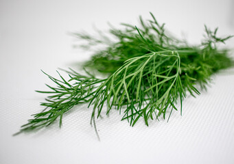 Dill is an aromatic green herb that tastes grassy with anise overtones