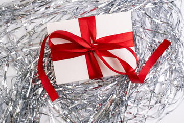 Gift box with a bow on a colored background. Happy Holidays, gift box close-up. Boxing Day...