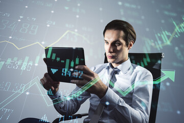 A professional man analyzing financial data on a tablet, with virtual stock market graphs overlaying the image, concept of financial analysis