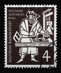 Stamp printed in Germany, shows Printer at the Gutenberg hand press, circa 1954
