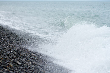 Sea wave crashing on the shore
