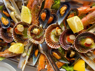 Assorted delicious grilled seafood.Restaurant marine  gourmet meal.Selective focus.