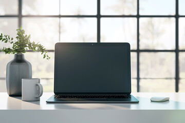 A modern laptop with a blank screen on a desk, a vase with greenery, a coffee mug, and a mouse, in a room with large windows, concept of a workspace. 3D Rendering