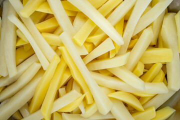 Raw cut french fries, different colors, full frame close up