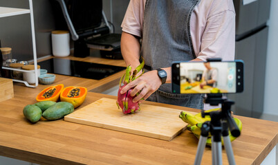 The chef is broadcasting live from workshop how to cuts and peels dragon fruit