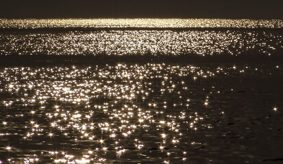 The glare of the sun in the water, sunspots in the Black Sea