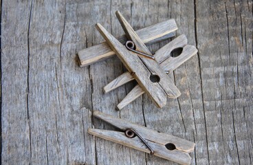 wooden clothespins on a wooden background close-up. selective focus