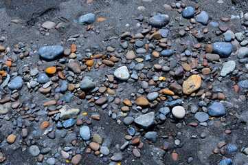 Kara-Dag, a round sea-rolled pebble from a volcanic rock on a pebble beach, Crimea