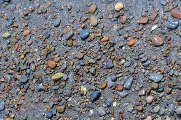 Kara-Dag, a round sea-rolled pebble from a volcanic rock on a pebble beach, Crimea
