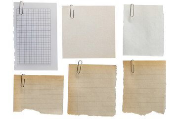 Set of old scraps of different types of paper with torn edges fixed with a paper clip on a...