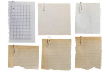 Set of old scraps of different types of paper with torn edges fixed with a paper clip on a transparent background.