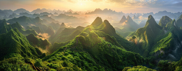 panoramic photo of an incredible mountain vista at sunrise, with rocky peaks and lush green...