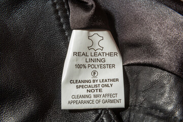 real leather written on material label on leather waistcoat