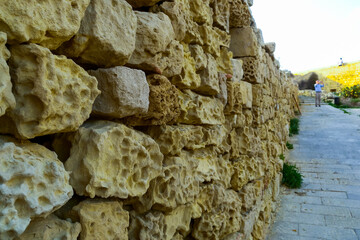 Weathering, erosion and destruction of limestone bricks of ancient structures on the island of...