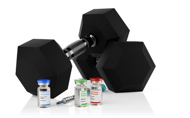 Testosterone, trenbolone and nandrolone steroid vials with syringe and two hexbell weights on white background, the most commonly used anabolic steroids for muscle growth in sport doping
