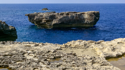 View of cliffs and rocky coastal slopes on Gozo island, Malta
