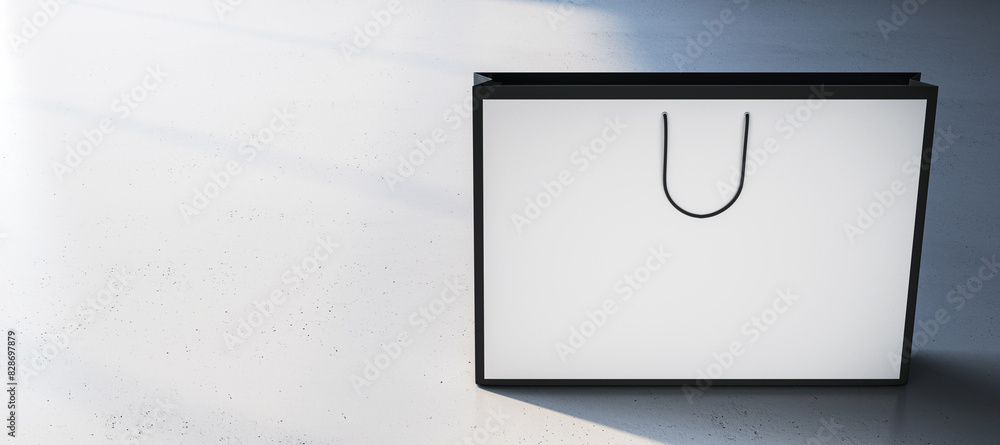 Aufkleber a clean white shopping bag with space for a logo on a textured floor and shadow play in the backgrou