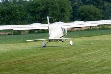Plane takeoff from a grass airport.