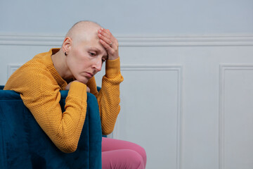 Woman in yellow sweater, feel worried and tired to fight cancer