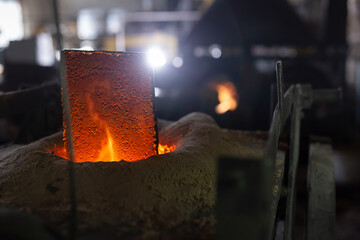 Ferrous metal billet is melted in an induction furnace closeup