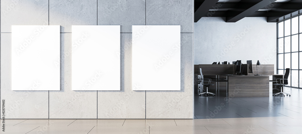 Poster three blank white posters in a modern office lobby with concrete wall, office furniture in backgroun