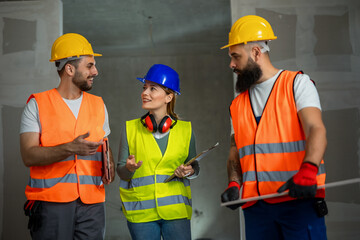 Construction team planning a building blueprint project on site with collaboration for architect...