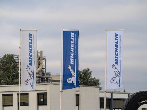 Three flags flying at the main entrance of the Michelin factory in Homburg, Saarland