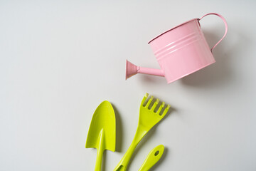 Colorful gardening instruments with watering can