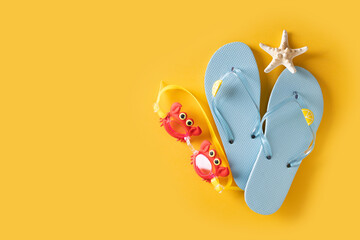 Flat lay with swimming accessories with flip flop, glasses