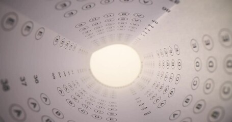 Exam test paper with IQ answer options rolled up in test tube. IQ test and test your intelligence