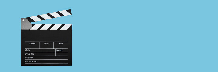 Cinema clapper board on a blue background, copy space, blackboard, clapboard, clapping, banner